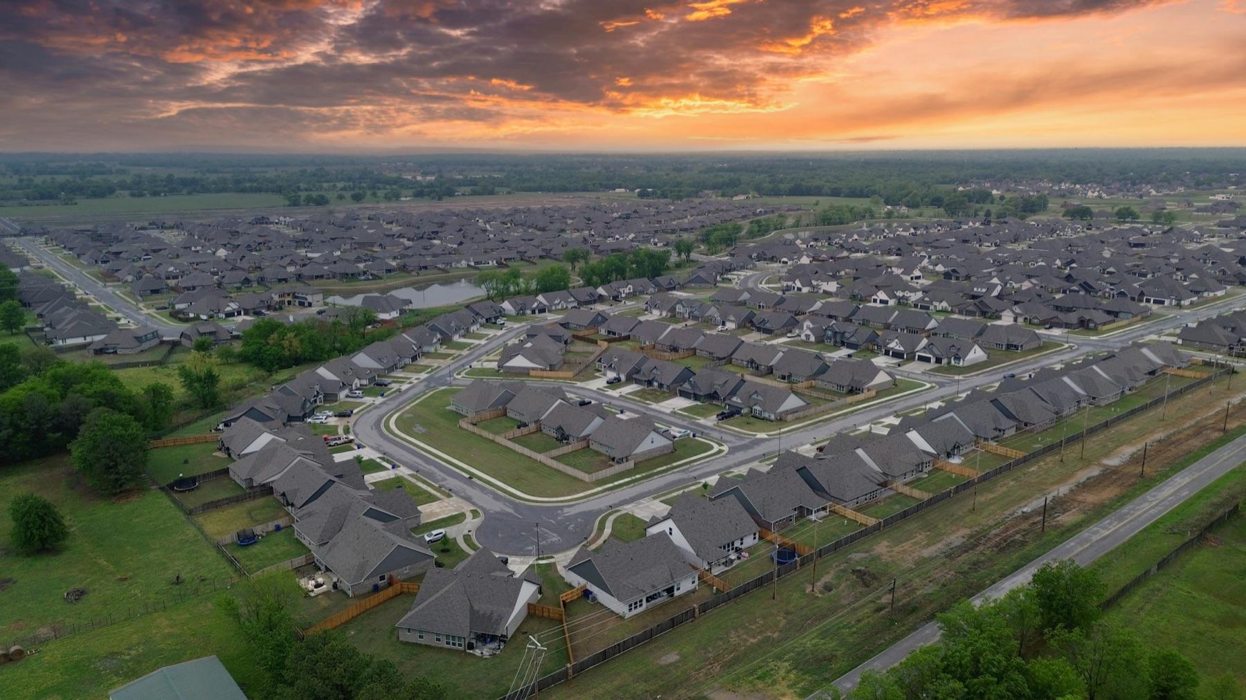 Aerial view of a single-family neighborhood at sunset